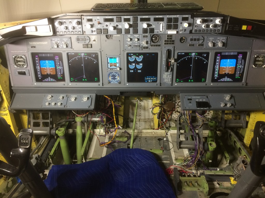 Main instrument panel (MIP) after final installation and alignment of primary flight displays. Empty space at the bottom is for FMC/CDU pedestal. 